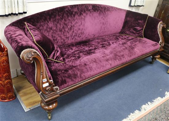 An early Victorian mahogany settee, upholstered in purple fabric W.230cm